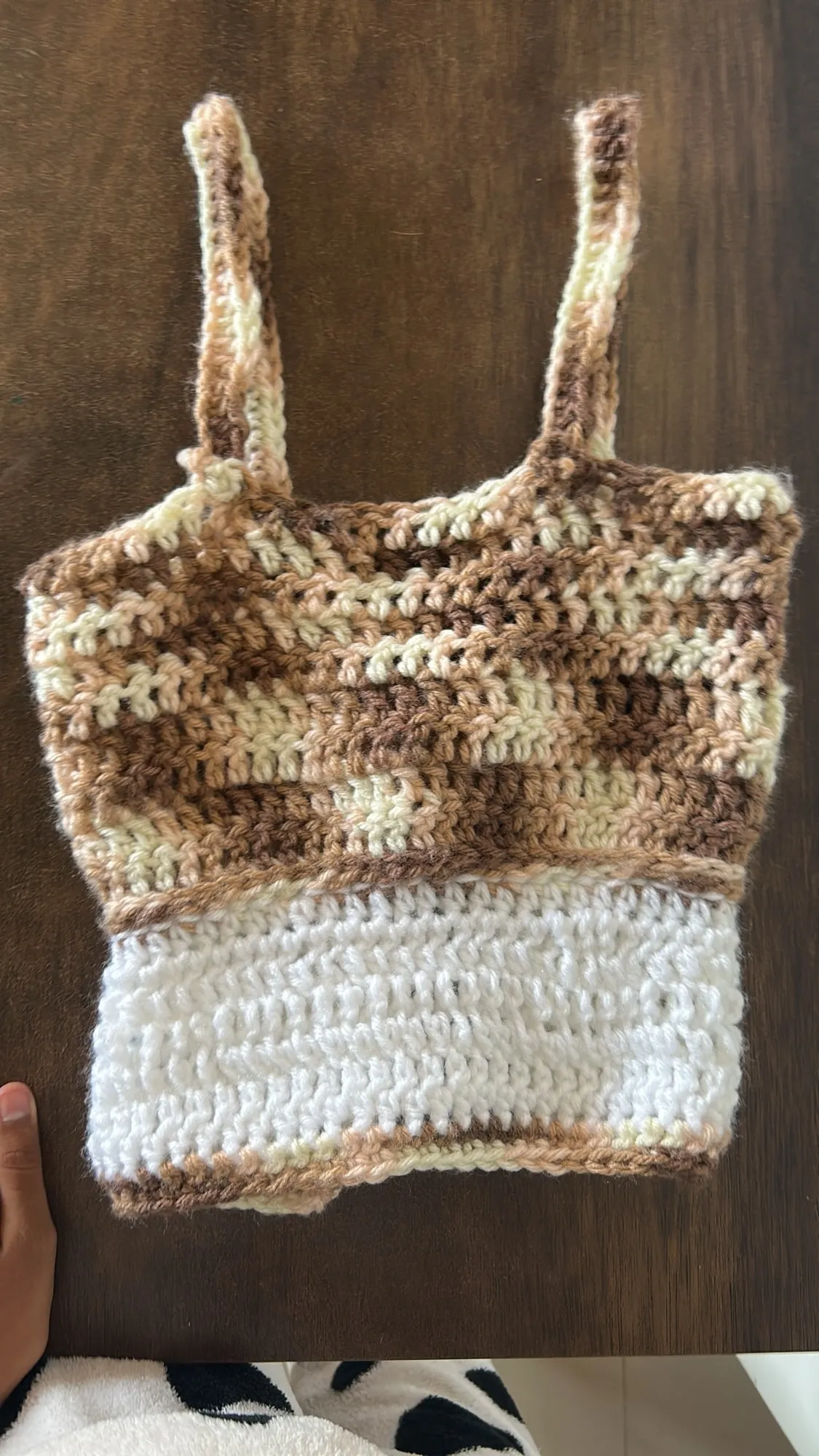 A cream and caramel striped crochet tote bag
