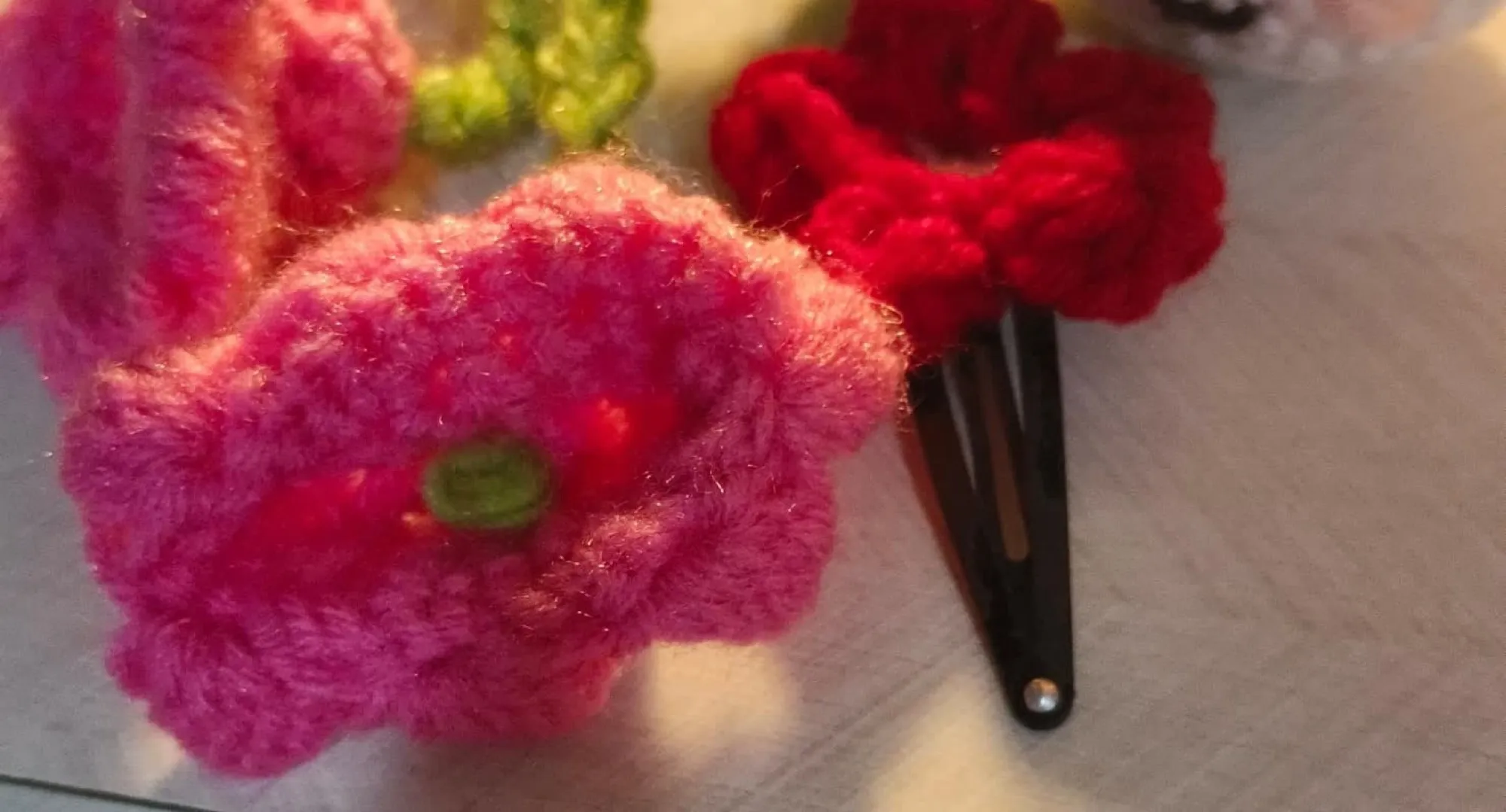 A yellow crochet marigold flower keyring